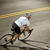top-view-of-a-male-cyclist-leaning-around-corner